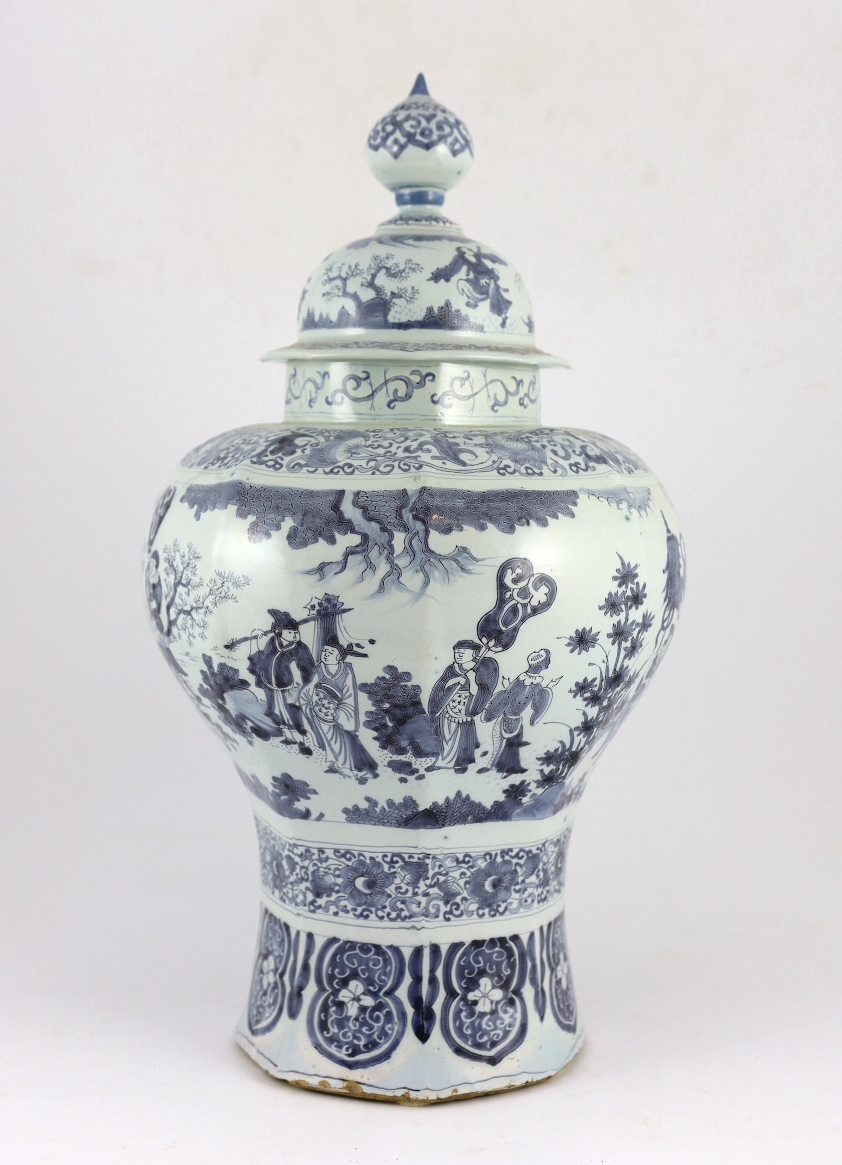 A massive Delft blue and white inverted baluster vase and cover, c.1700, 57.5cm high, neck and cover restored